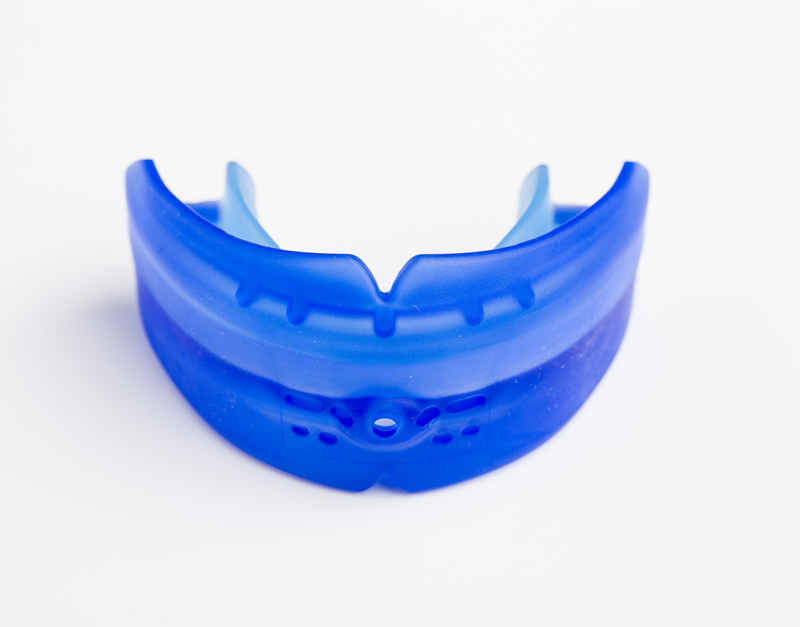 Blue flexible mouthguard, helps protect from dental trauma, but talk with your AAO orthodontist to see which one is right for you.