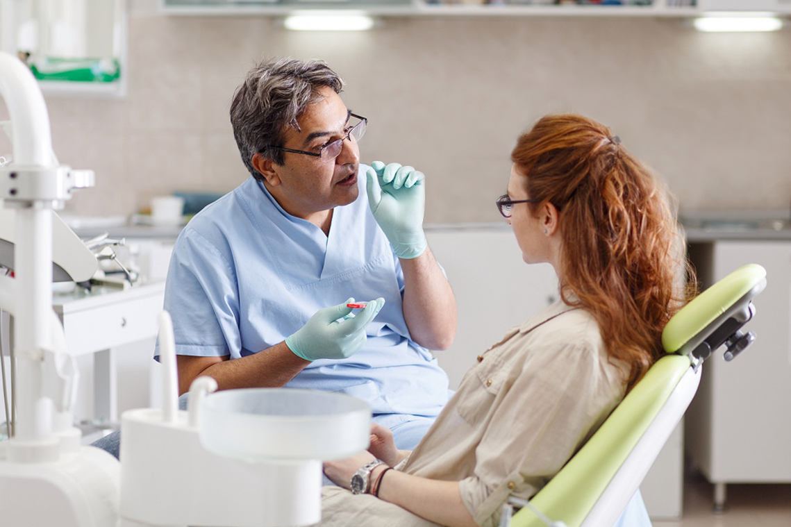 Orthodontist and patient, discussing her upcoming unique treatment plan.