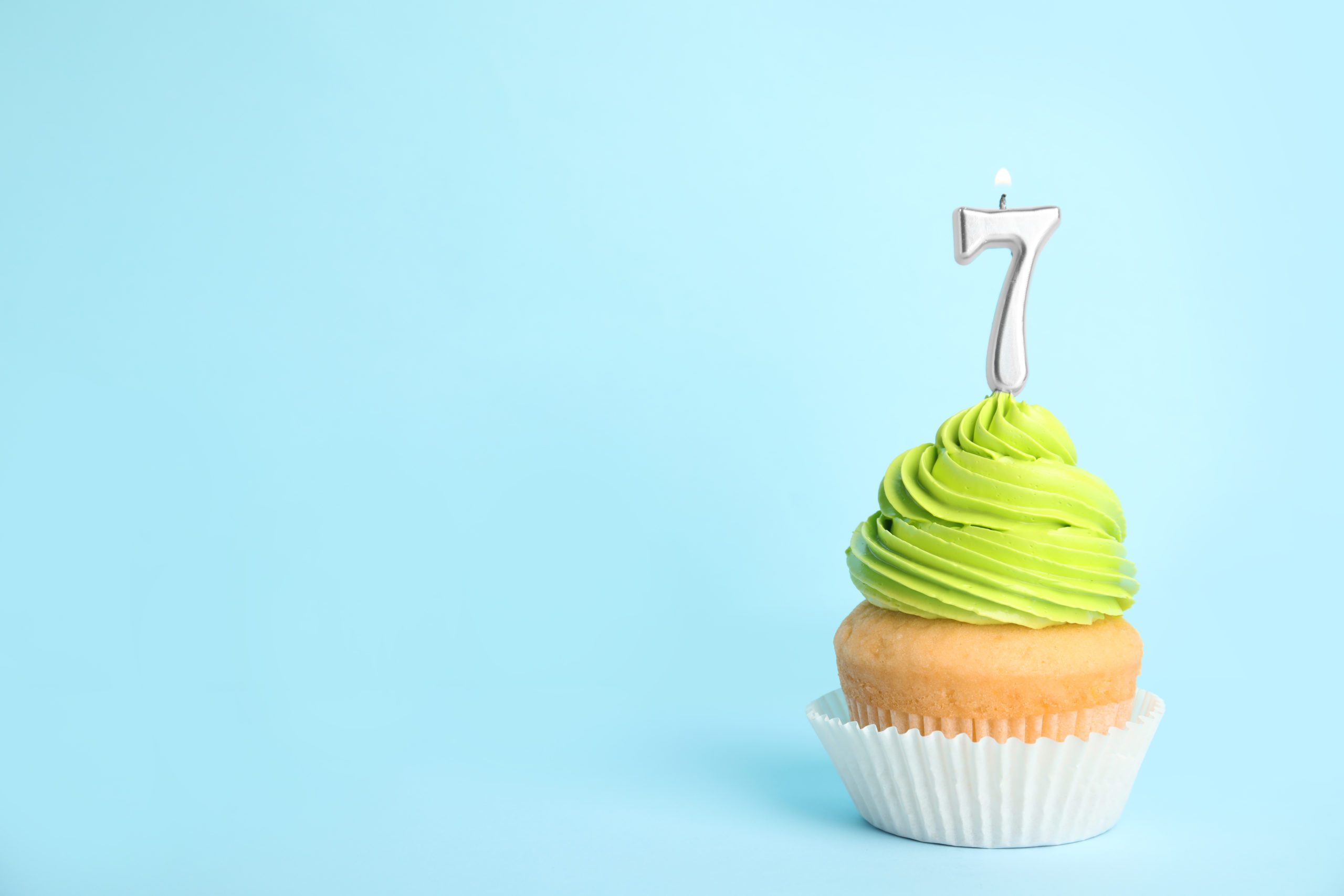 Cupcake with a 7 candle in it.